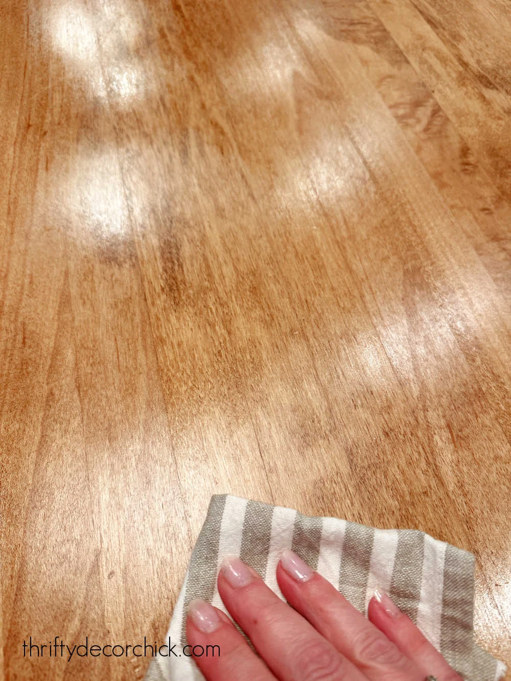 wiping Tung oil on wood counter